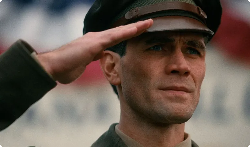 KJ Apa as Jimmy Stewart saluting in uniform